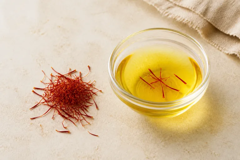 Editorial image showing saffron threads steeped spice.