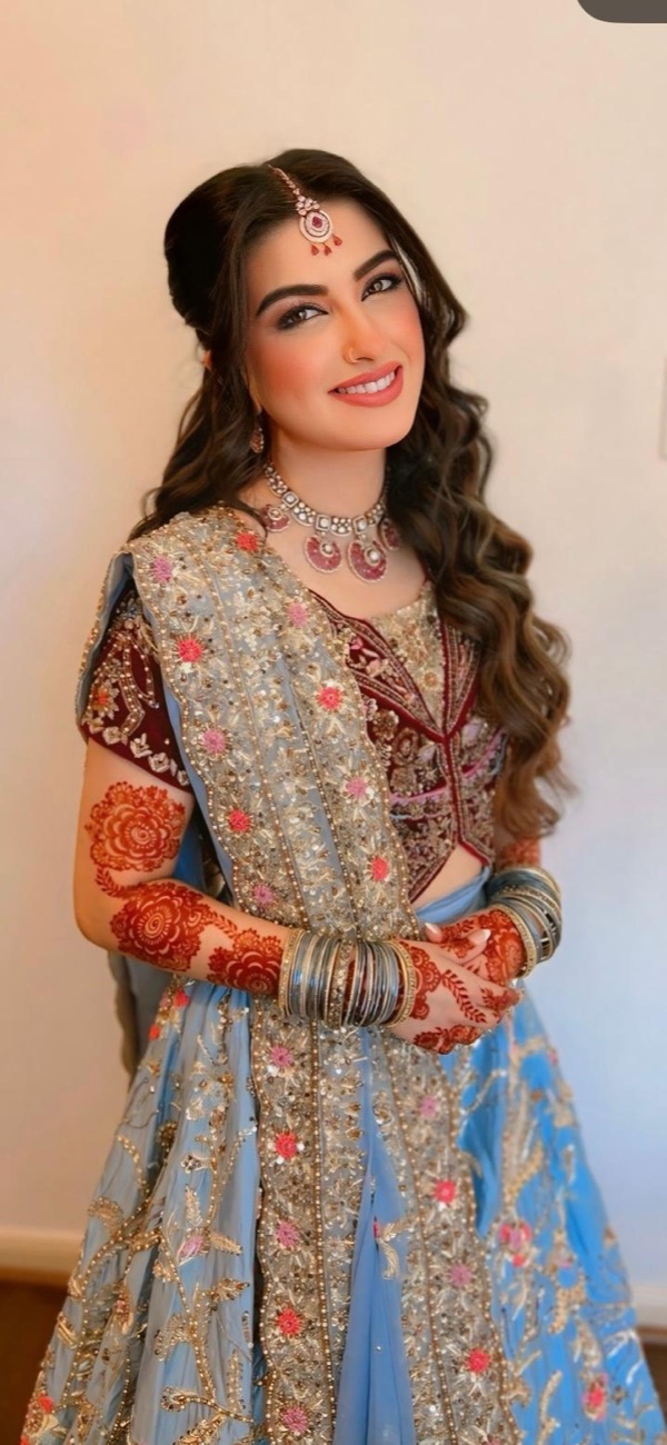 Bridal lehenga look with soft glam and mehndi by Makeup by Nidari
