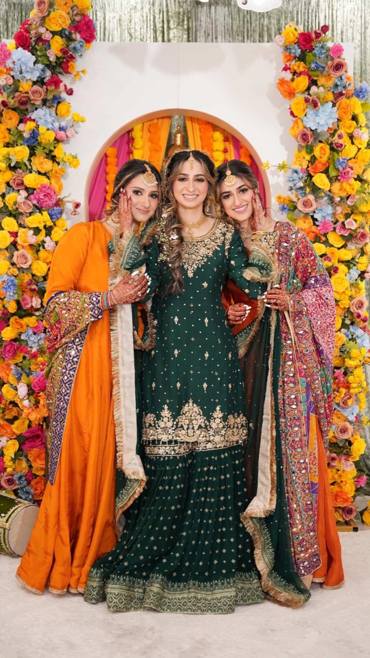 Bridal party makeup and styling at a floral backdrop by Makeup by Nidari, Houston