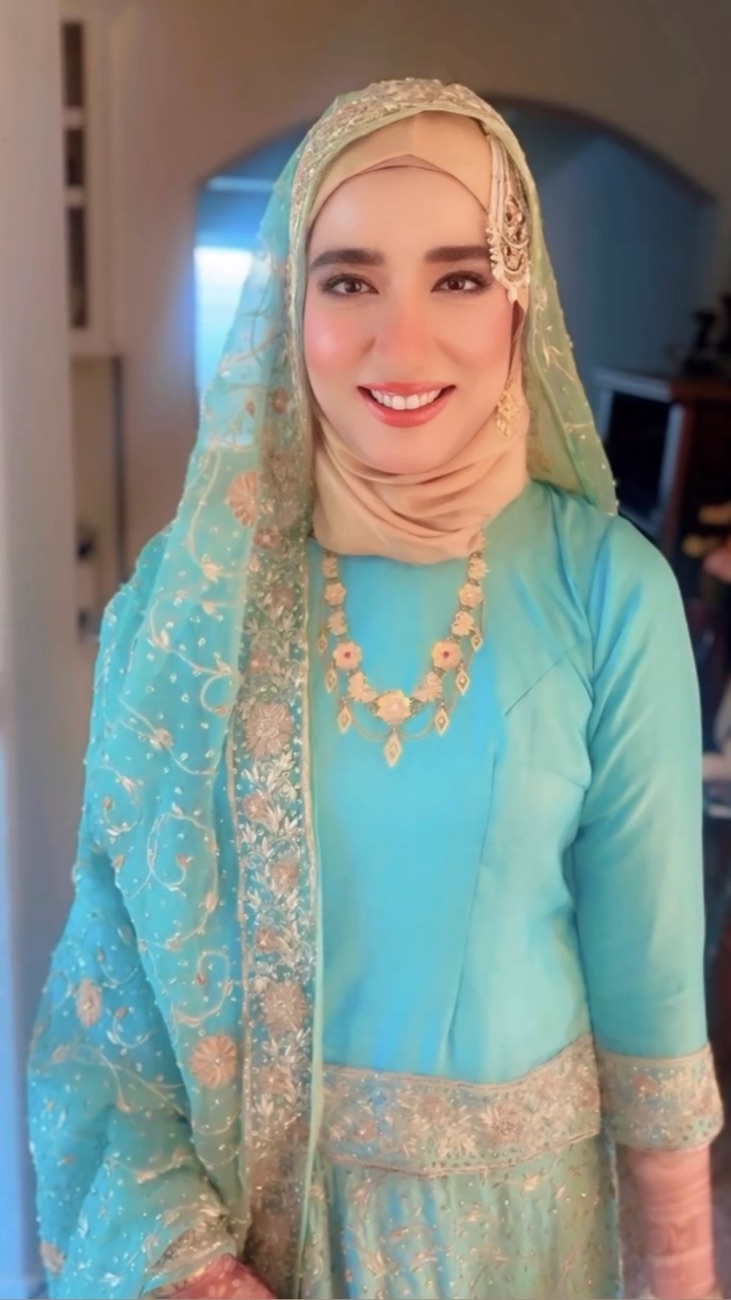 Hijab bridal makeup with a gold maang tikka